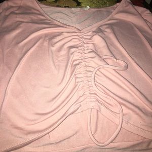 Pink crop top with adjustable string in the middle